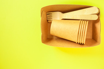 cutlery wooden, craft paper (eco friendly forks, plates, biodegradable materials) food containers eco packaging, menu concept. food background. copy space