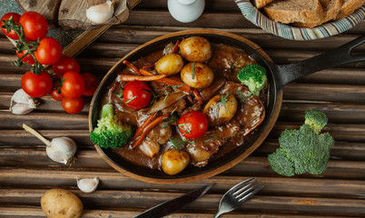 beef stew with potato, broccoli, tomato, carrot and coriander chops