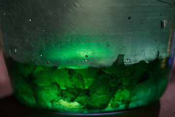 Alchemy bottles in laboratory of alchemist. Colorful drink in glass old pots. Alchemy symbol and objects. Poison and elixir in glass jar. Vessel, ampulla, flask.