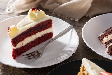 Red velvet cake slice on wooden table