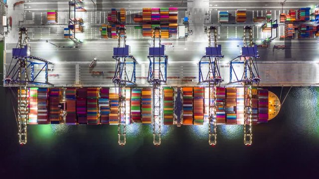 Aerial view container cargo ship at industrial port in import export business logistic and transportation of international by container cargo ship in the open sea.