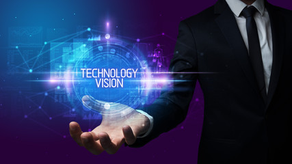 Man hand holding TECHNOLOGY VISION inscription, technology concept