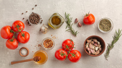 Set of products for Italian sauce. Tomatoes, garlic, rosemary and spices.
