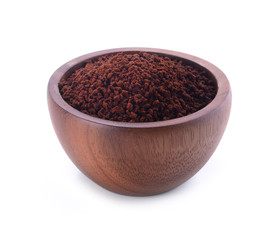 Coffee powder burst in bowl on white background