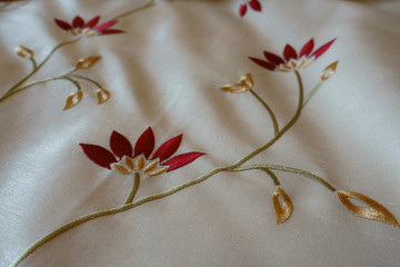 White cloth with old fashioned floral embroidery