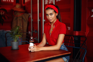 Young beautiful girl in cafe