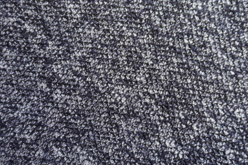 Surface of dark blue melange woolen fabric from above