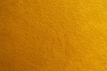 Amber yellow knitted woolen fabric from above