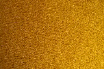 Top view of amber yellow woolen fabric