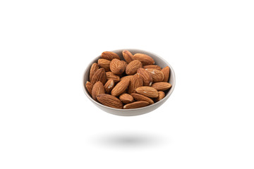 almonds in a bowl isolated on white background