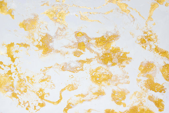 Abstract marble fluid art mix gold oil paint and white acrylic paint on paper background