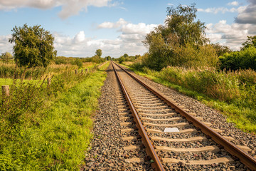 Fototapeta na wymiar Straight single track rails seemingly endless
