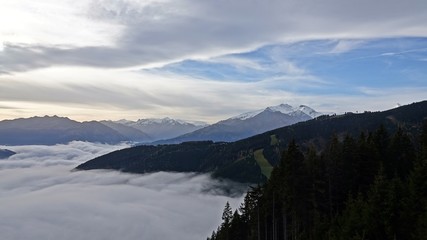 Fototapeta na wymiar autumn in the mountain with fog in the valley