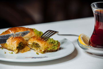 turkish pakhlava with pistacios served with black tea