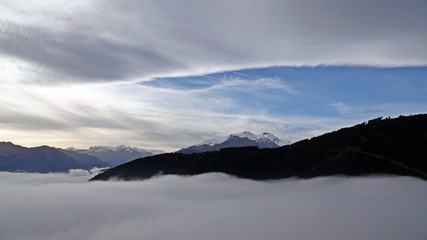 autumn in the mountain with fog in the valley