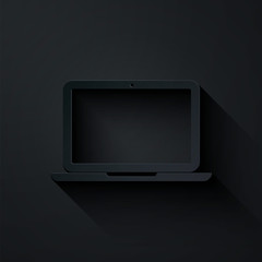 Paper cut Laptop icon isolated on black background. Computer notebook with empty screen sign. Paper art style. Vector Illustration © vector_v