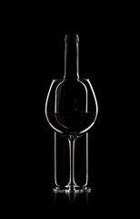 bottle and wine glass with red wine