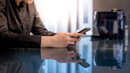 Mobile app for internet of things. Big data technology and cloud computing. Businessman hand...