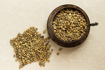 green coffee beans on antique bowl, cup