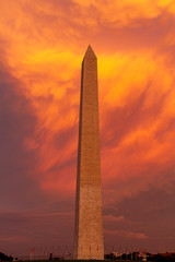 The Washington Monument during sunset with the clouds behind the monument lite in brilliant evening...