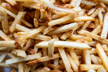 A close up view of potato chipstick style crisps.