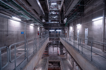 View of the plant from the outside, pipes smoke, wind turbines in the sea, barrels, tanks, thermal power plant, modern, technological waste processing plant, garbage processing plant