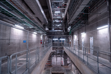 View of the plant from the outside, pipes smoke, wind turbines in the sea, barrels, tanks, thermal power plant, modern, technological waste processing plant, garbage processing plant