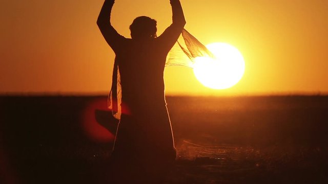 warrior with Kalashnikov at sunset day. fighter is training with a machine gun at sunset.