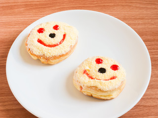 Smiley face, A smiley donut on a plate, white background