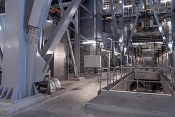 View of the plant from the outside, pipes smoke, wind turbines in the sea, barrels, tanks, thermal power plant, modern, technological waste processing plant, garbage processing plant