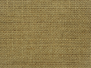 Close-up of hessian sackcloth woven vintage style material texture pattern background in beige color for used as backdrop or background