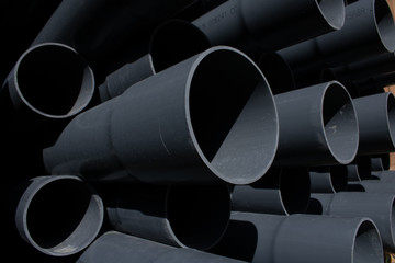 Black plastic pipelines background. Urban design.Abstract arts.Industrial material.Construction and...