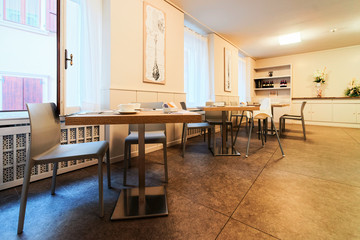 Hotel breakfast restaurant interior on background architecture
