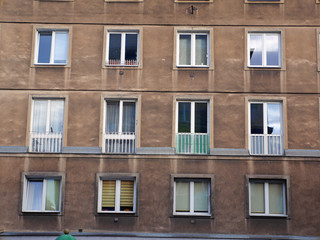 Fototapeta na wymiar facade of building town windows block