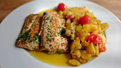 healthy and fresh cooking at home - salmon fillet with potatoes in olive oil