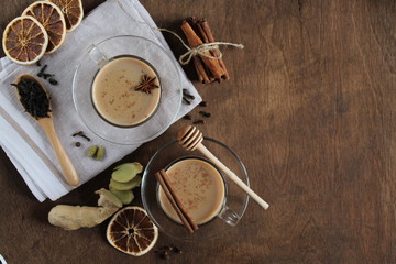 Traditional Indian masala Chai tea with spices. Hot drink of black tea, milk and spices. Side view, copy space, close-up