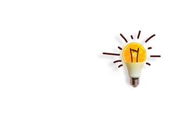 Creative conceptof a luminous energy-saving light bulb on white background. Energy conservation or idea concept.