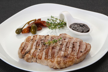 Grilled pork steak with pepper sauce