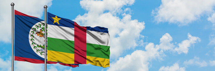 Belize and Central African Republic flag waving in the wind against white cloudy blue sky together. Diplomacy concept, international relations.