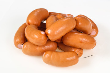 Tasty meat sausages over white background