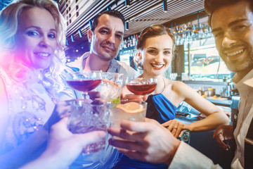 Four friends in a bar