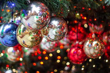 Christmas ornaments on the Christmas tree with bokeh background