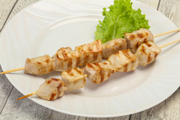 Grilled pork skewer served salad