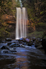 Fototapeta na wymiar Henrhyd Falls near Coelbren, with a drop of 90 feet it's the highest waterfall in South Wales, UK.