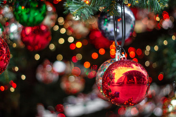 Christmas ornaments on the Christmas tree with bokeh background