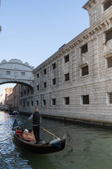 Fototapeta na wymiar View of the Bridge of Sighs or Ponte dei Sospiri with gondola. Travel, holiday photo. Venice. Italy. Europe.