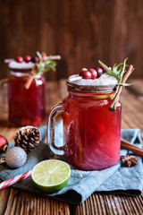 Christmas drink, hot mulled wine with cranberries, lime, star anise and cinnamon