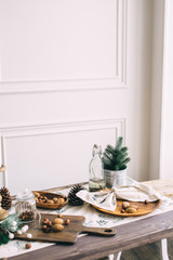 Christmas composition with nuts and candlesticks