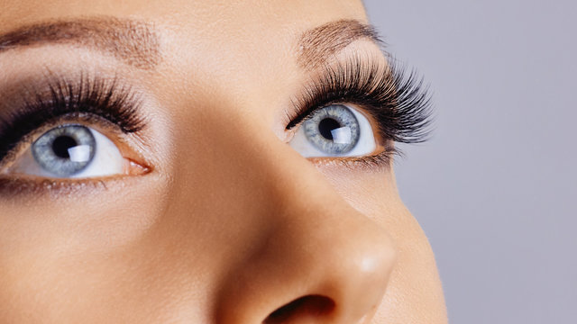 Woman eyes with long eyelashes and smokey eyes make-up. Eyelash extensions, makeup, cosmetics, beauty