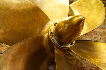 Bronze six bladed propeller screw of a boat or ship. The brass ship screw propeller helps in ship...